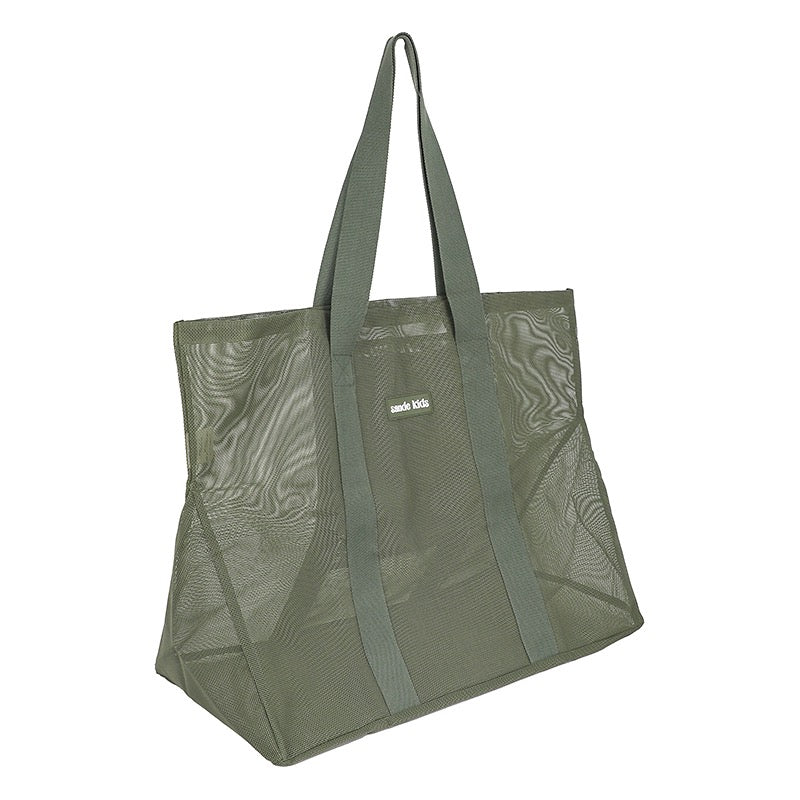 Side view of the Sande Kids mesh beach bag - the Beach Hauler in Pandanus green.