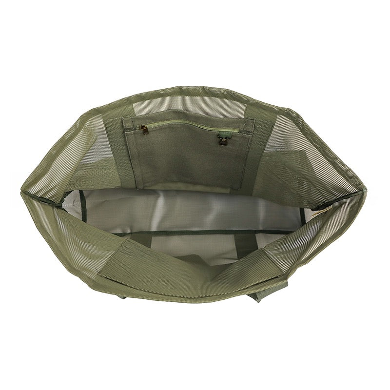 Internal pockets of the Sande Kids Beach Hauler mesh bewach bag in olive sage green. White background.