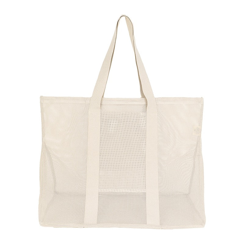 Rear view of the Sande Kids Oversized Beach Hauler mesh beach bag in Sand/neutral, emphasizing its spacious design, durable mesh fabric, and practicality for family beach outings and outdoor activities.