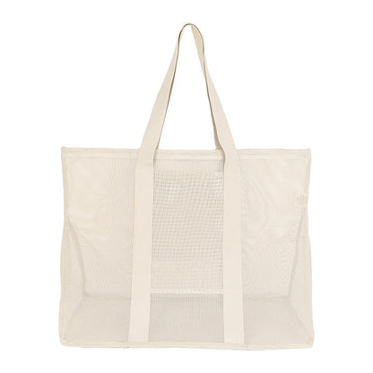 Rear view of the Sande Kids Oversized Beach Hauler mesh beach bag in Sand/neutral, emphasizing its spacious design, durable mesh fabric, and practicality for family beach outings and outdoor activities.