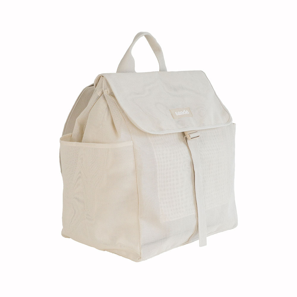 45-degree angled view of the Sande Kids Beach Hauler mesh backpack in neutral Sand colour on a white background, showcasing its spacious design and sturdy construction.